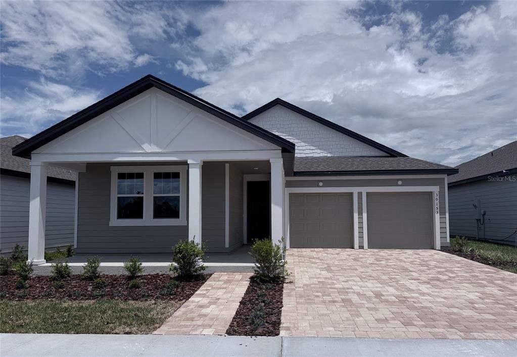 Front exterior of a new home in , Mount Dora, FL, highlighting curb appeal (Image 1). Front exterior of a new home in , Mount Dora, FL, highlighting curb appeal (Image 1).