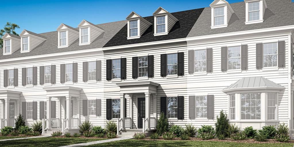Front exterior of a new home in Celebration - Island Village, Celebration, FL, highlighting curb appeal (Image 1). Front exterior of a new home in Celebration - Island Village, Celebration, FL, highlighting curb appeal (Image 1).