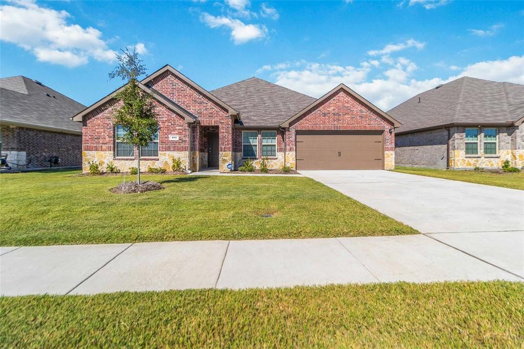 Front exterior of a new home in Stonehaven, Caddo Mills, TX, highlighting curb appeal (Image 1). Front exterior of a new home in Stonehaven, Caddo Mills, TX, highlighting curb appeal (Image 1).