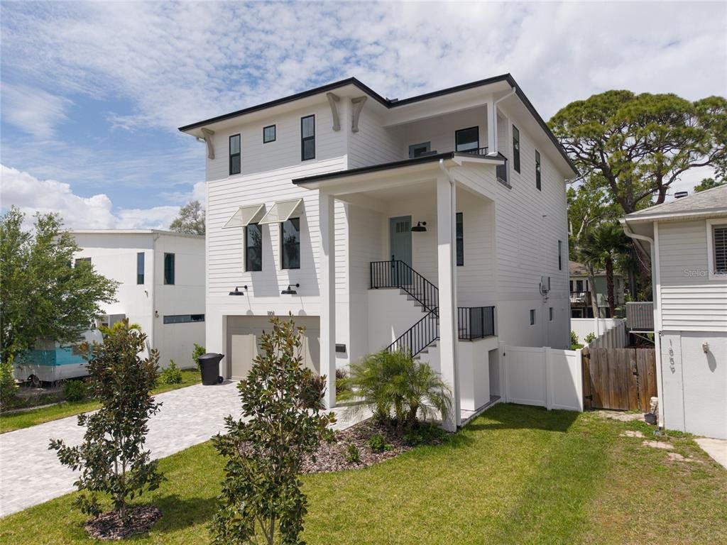 Front exterior of a new home in , St. Petersburg, FL, highlighting curb appeal (Image 1). Front exterior of a new home in , St. Petersburg, FL, highlighting curb appeal (Image 1).