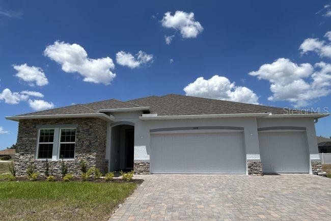 Front exterior of a new home in , Homosassa, FL, highlighting curb appeal (Image 1). Front exterior of a new home in , Homosassa, FL, highlighting curb appeal (Image 1).