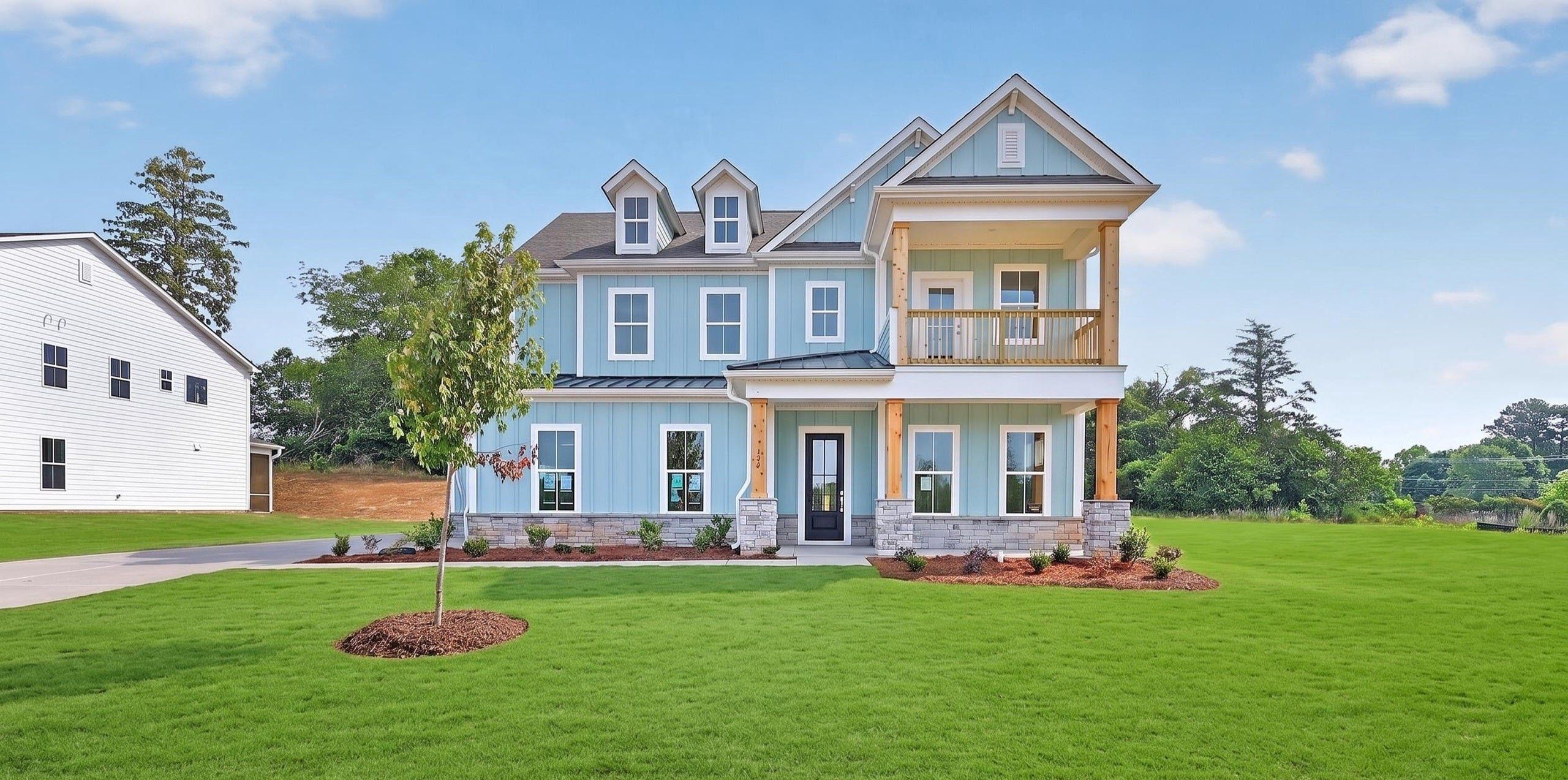 Front exterior of a new home in Braxton Ridge, Simpsonville, SC, highlighting curb appeal (Image 1). Front exterior of a new home in Braxton Ridge, Simpsonville, SC, highlighting curb appeal (Image 1).