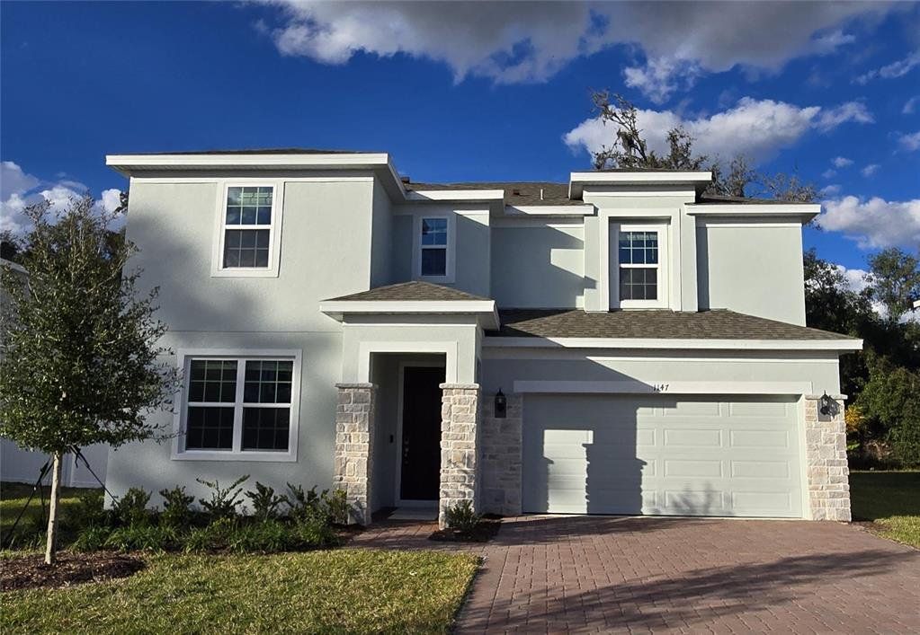 Front exterior of a new home in Beresford Woods, Deland, FL, highlighting curb appeal (Image 1). Front exterior of a new home in Beresford Woods, Deland, FL, highlighting curb appeal (Image 1).