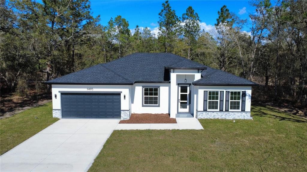 Front exterior of a new home in , Citrus Springs, FL, highlighting curb appeal (Image 1). Front exterior of a new home in , Citrus Springs, FL, highlighting curb appeal (Image 1).