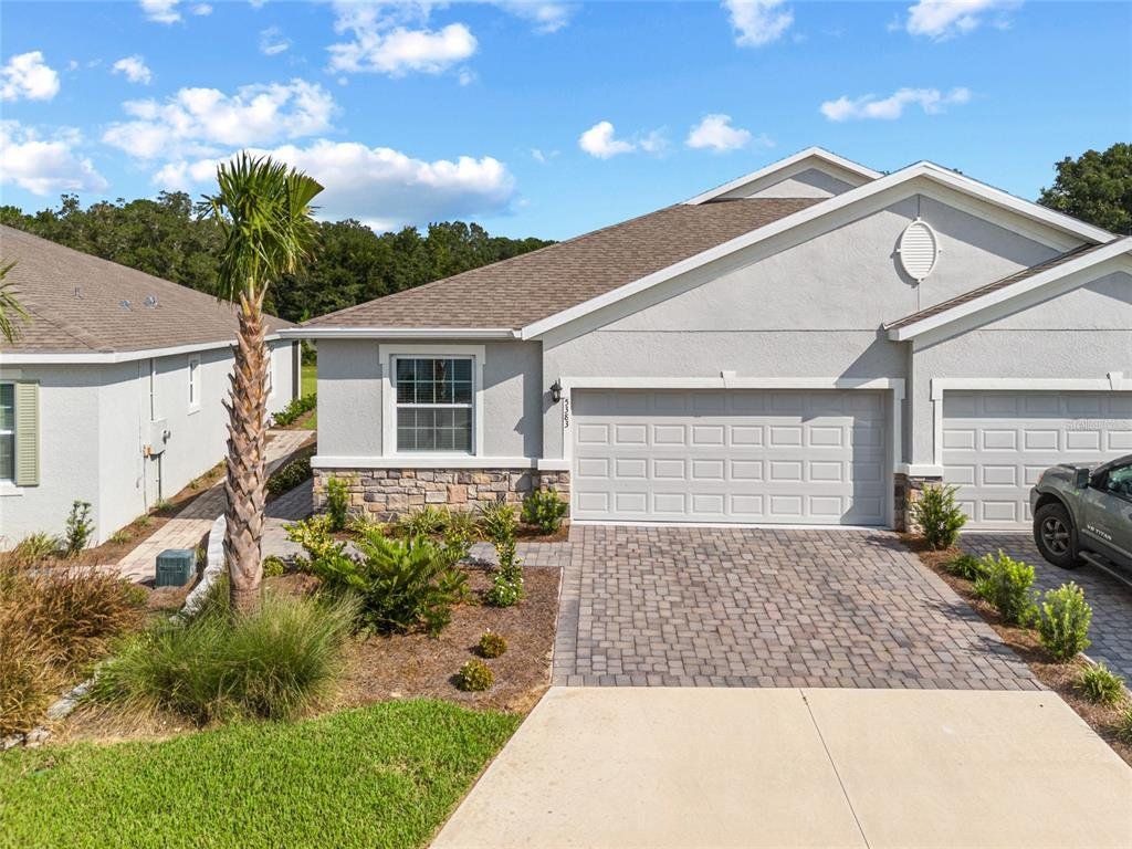Front exterior of a new home in , Ocala, FL, highlighting curb appeal (Image 1). Front exterior of a new home in , Ocala, FL, highlighting curb appeal (Image 1).