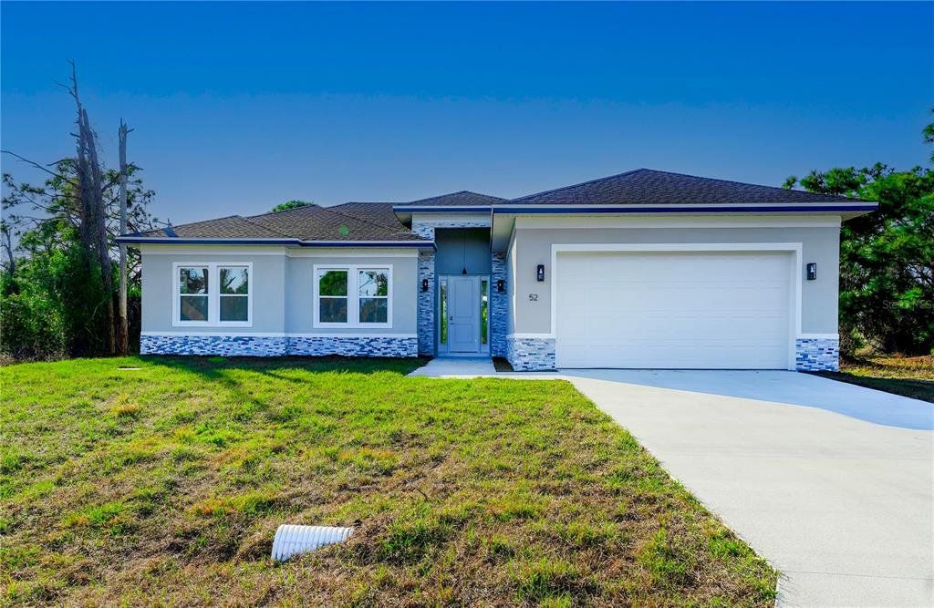 Front exterior of a new home in , Placida, FL, highlighting curb appeal (Image 1). Front exterior of a new home in , Placida, FL, highlighting curb appeal (Image 1).