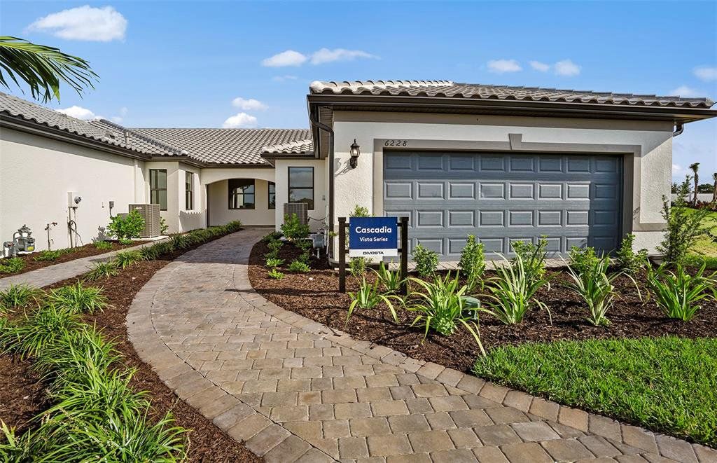 Front exterior of a new home in Talon Preserve on Palmer Ranch, Nokomis, FL, highlighting curb appeal (Image 1). Front exterior of a new home in Talon Preserve on Palmer Ranch, Nokomis, FL, highlighting curb appeal (Image 1).