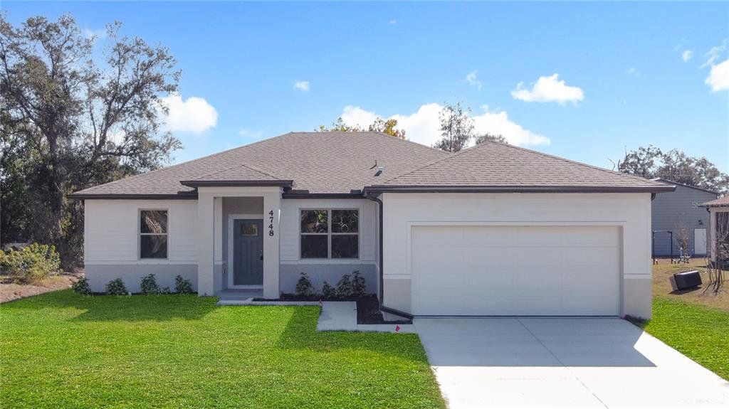 Front exterior of a new home in , North Port, FL, highlighting curb appeal (Image 1). Front exterior of a new home in , North Port, FL, highlighting curb appeal (Image 1).