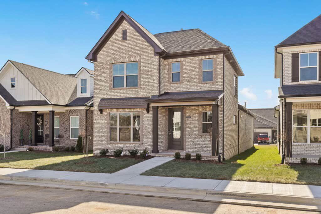 Front exterior of a new home in The Paddock Courtyard, Bungalow, & Villa Homes, Gallatin, TN, highlighting curb appeal (Image 1). Front exterior of a new home in The Paddock Courtyard, Bungalow, & Villa Homes, Gallatin, TN, highlighting curb appeal (Image 1).