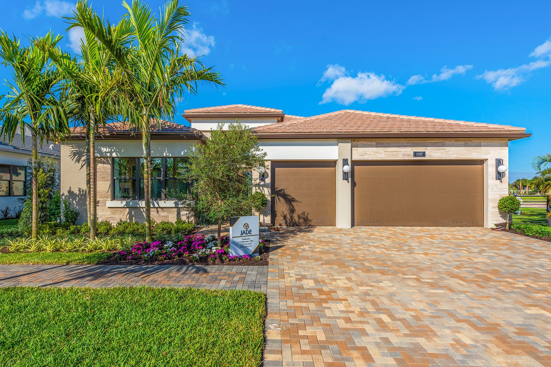 Front exterior of a new home in Valencia Del Mar (55+), Boynton Beach, FL, highlighting curb appeal (Image 1). Front exterior of a new home in Valencia Del Mar (55+), Boynton Beach, FL, highlighting curb appeal (Image 1).