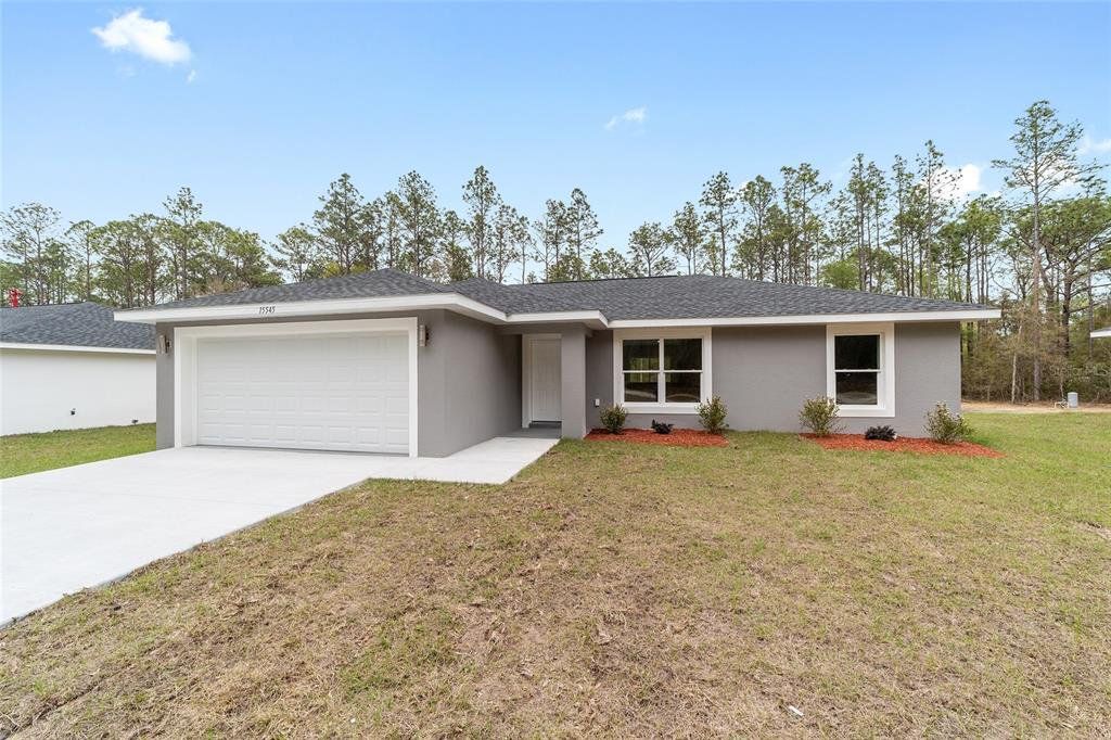 Front exterior of a new home in , Dunnellon, FL, highlighting curb appeal (Image 1). Front exterior of a new home in , Dunnellon, FL, highlighting curb appeal (Image 1).