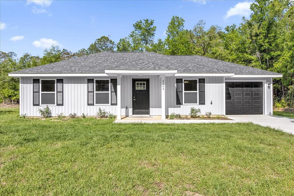 Front exterior of a new home in , Dunnellon, FL, highlighting curb appeal (Image 1). Front exterior of a new home in , Dunnellon, FL, highlighting curb appeal (Image 1).