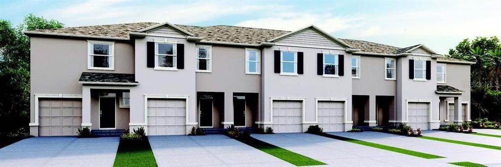 Front exterior of a new home in Venezia, Howey-in-the-Hills, FL, highlighting curb appeal (Image 1).