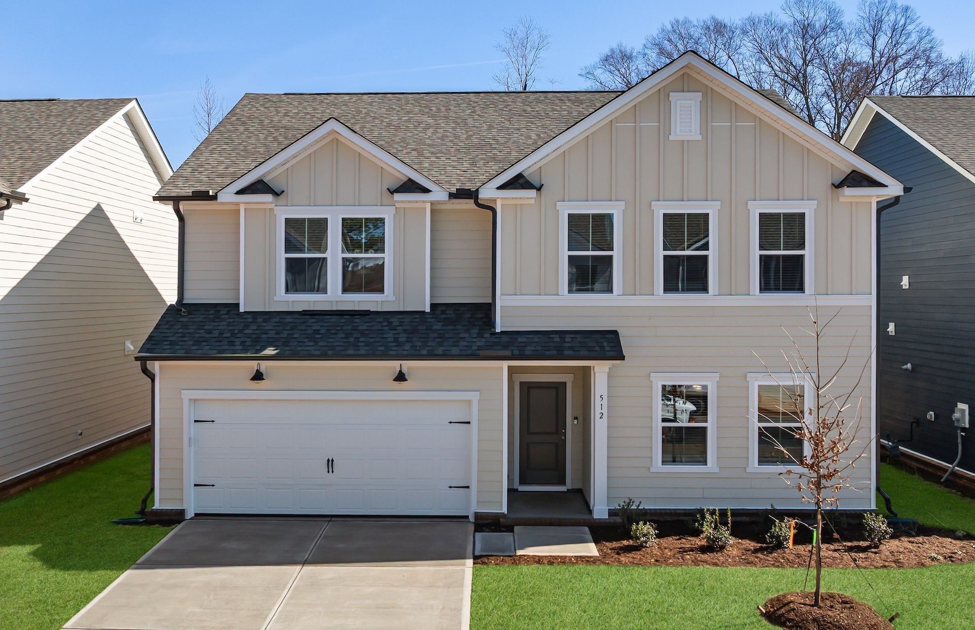 Front exterior of a new home in Exchange at 401, Raleigh, NC, highlighting curb appeal (Image 1). Front exterior of a new home in Exchange at 401, Raleigh, NC, highlighting curb appeal (Image 1).