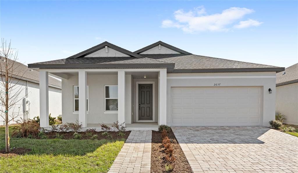 Front exterior of a new home in , Kissimmee, FL, highlighting curb appeal (Image 1). Front exterior of a new home in , Kissimmee, FL, highlighting curb appeal (Image 1).