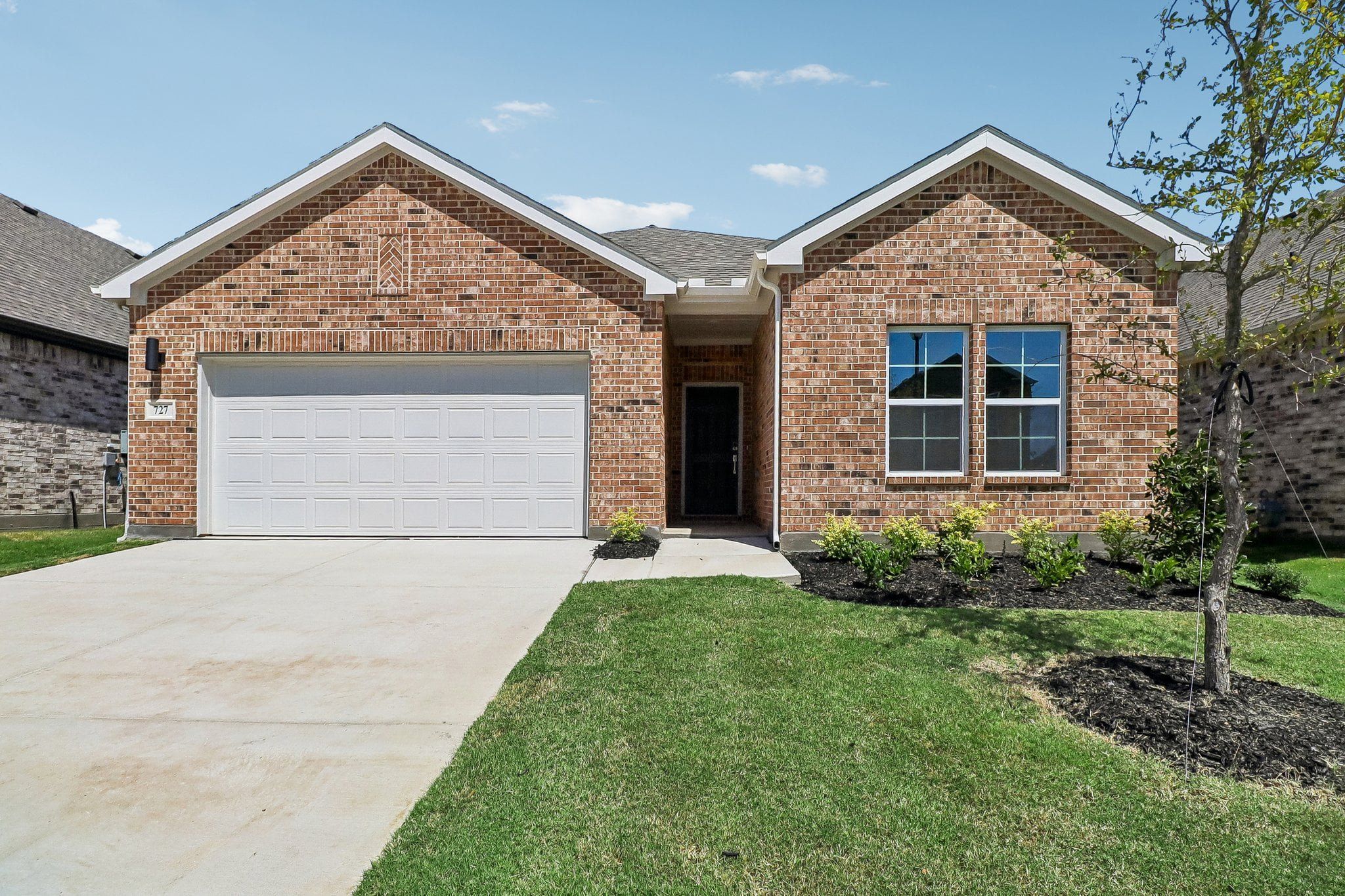 Front exterior of a new home in Overland Grove, Forney, TX, highlighting curb appeal (Image 1). Front exterior of a new home in Overland Grove, Forney, TX, highlighting curb appeal (Image 1).