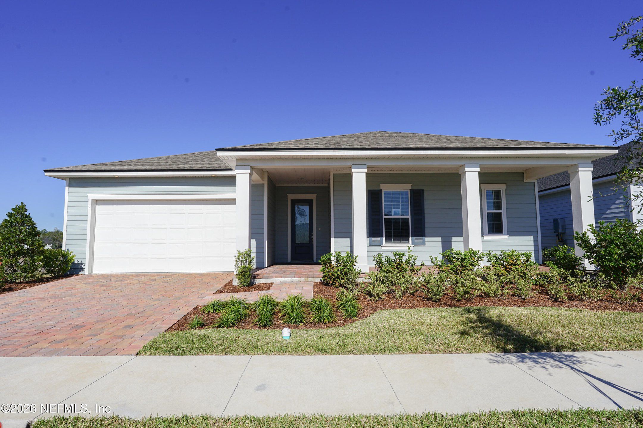 Front exterior of a new home in , Palm Coast, FL, highlighting curb appeal (Image 1). Front exterior of a new home in , Palm Coast, FL, highlighting curb appeal (Image 1).
