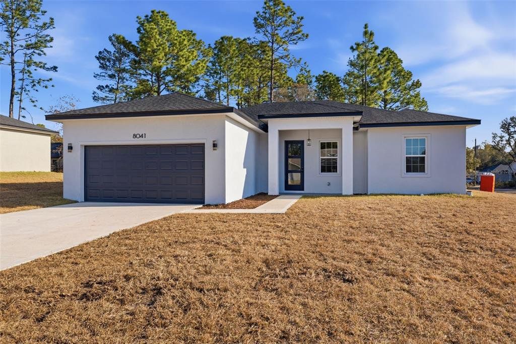 Front exterior of a new home in , Citrus Springs, FL, highlighting curb appeal (Image 1). Front exterior of a new home in , Citrus Springs, FL, highlighting curb appeal (Image 1).