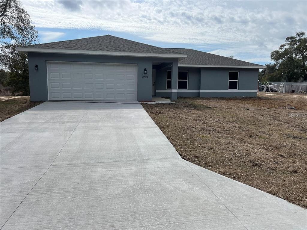 Front exterior of a new home in , Dunnellon, FL, highlighting curb appeal (Image 1). Front exterior of a new home in , Dunnellon, FL, highlighting curb appeal (Image 1).