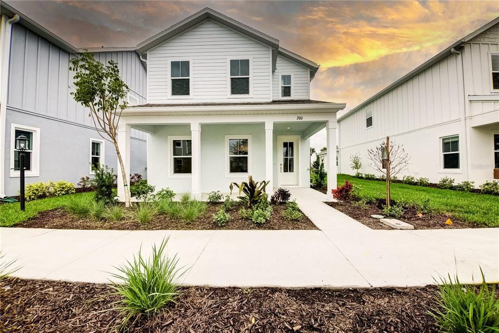 Front exterior of a new home in , Lakewood Ranch, FL, highlighting curb appeal (Image 1). Front exterior of a new home in , Lakewood Ranch, FL, highlighting curb appeal (Image 1).