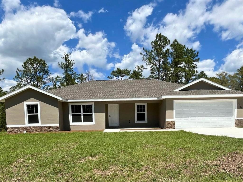Front exterior of a new home in , Dunnellon, FL, highlighting curb appeal (Image 1). Front exterior of a new home in , Dunnellon, FL, highlighting curb appeal (Image 1).