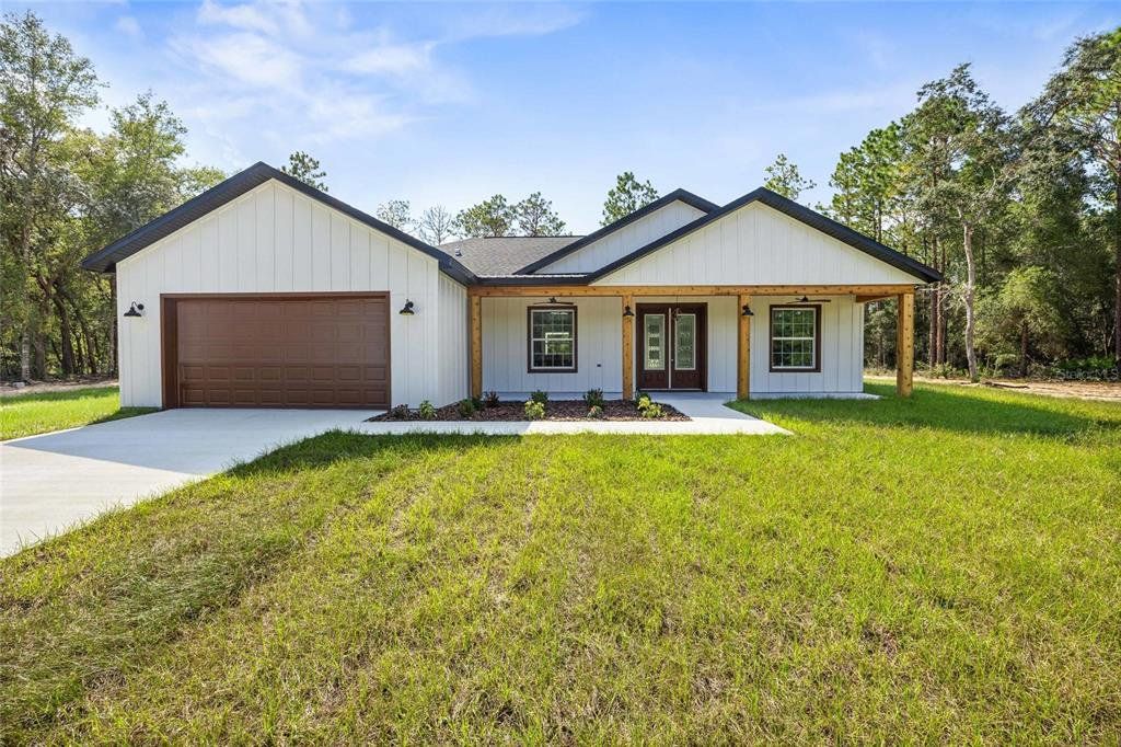 Front exterior of a new home in , Dunnellon, FL, highlighting curb appeal (Image 1). Front exterior of a new home in , Dunnellon, FL, highlighting curb appeal (Image 1).