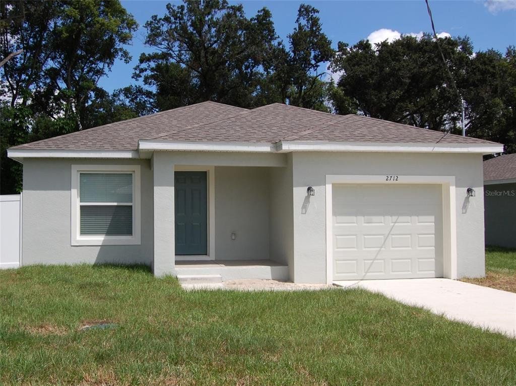 Front exterior of a new home in , Auburndale, FL, highlighting curb appeal (Image 1). Front exterior of a new home in , Auburndale, FL, highlighting curb appeal (Image 1).