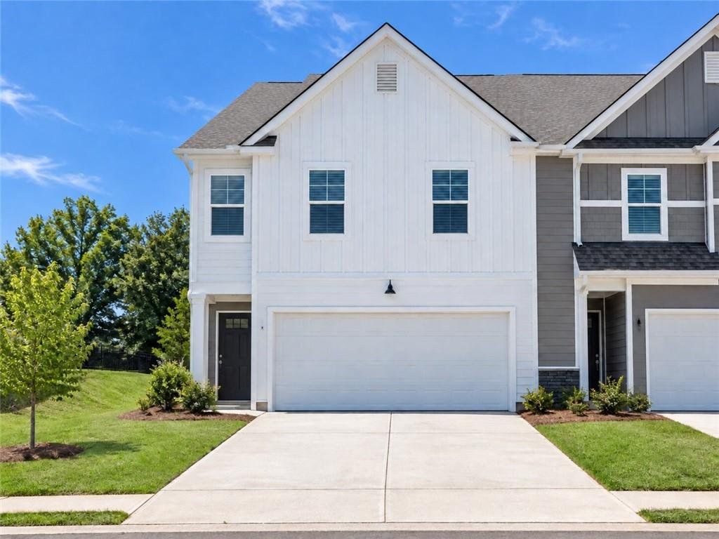 Front exterior of a new home in Walden Park – The Collection, Jonesboro, GA, highlighting curb appeal (Image 1). Front exterior of a new home in Walden Park – The Collection, Jonesboro, GA, highlighting curb appeal (Image 1).