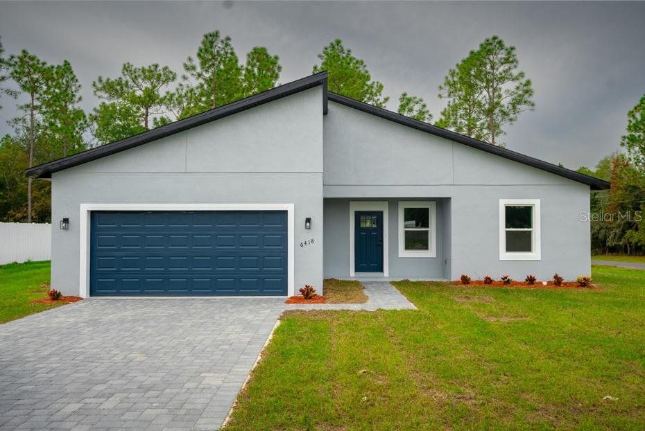Front exterior of a new home in , Ocala, FL, highlighting curb appeal (Image 1). Front exterior of a new home in , Ocala, FL, highlighting curb appeal (Image 1).