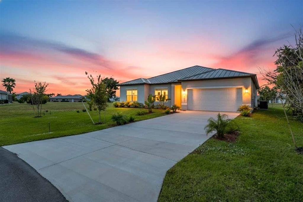 Front exterior of a new home in , Punta Gorda, FL, highlighting curb appeal (Image 1). Front exterior of a new home in , Punta Gorda, FL, highlighting curb appeal (Image 1).