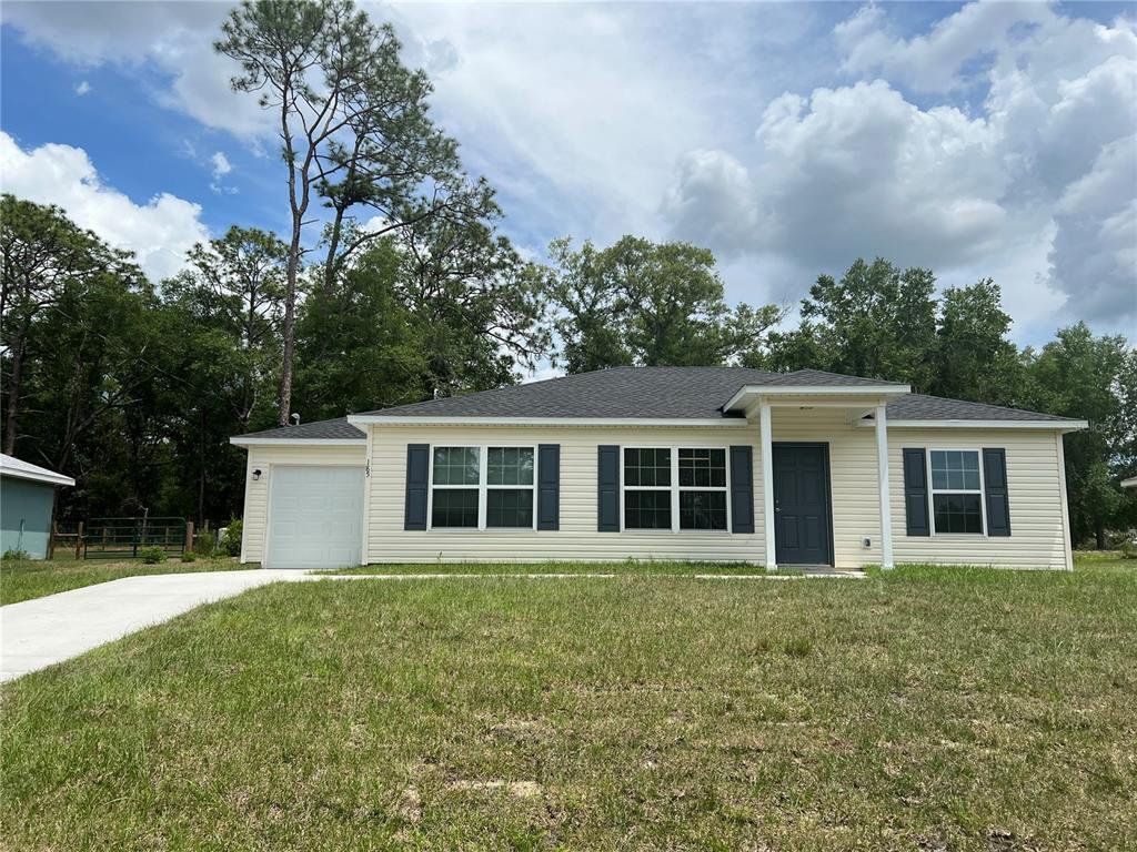 Front exterior of a new home in , Ocklawaha, FL, highlighting curb appeal (Image 1). Front exterior of a new home in , Ocklawaha, FL, highlighting curb appeal (Image 1).