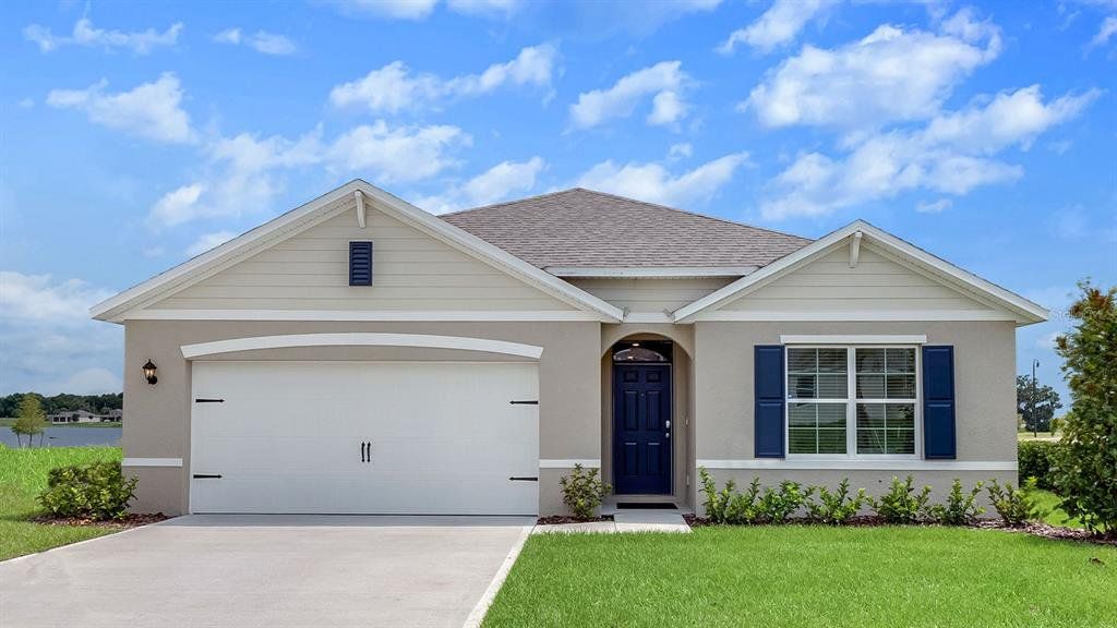 Front exterior of a new home in Lake Deer Estates, Poinciana, FL, highlighting curb appeal (Image 1). Front exterior of a new home in Lake Deer Estates, Poinciana, FL, highlighting curb appeal (Image 1).