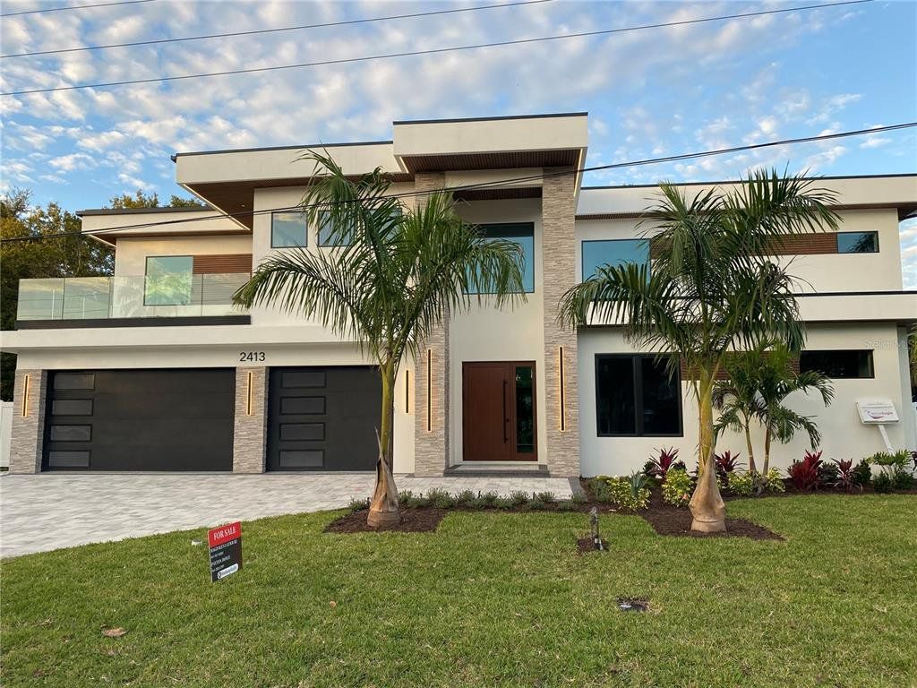 Front exterior of a new home in , Sarasota, FL, highlighting curb appeal (Image 1). Front exterior of a new home in , Sarasota, FL, highlighting curb appeal (Image 1).