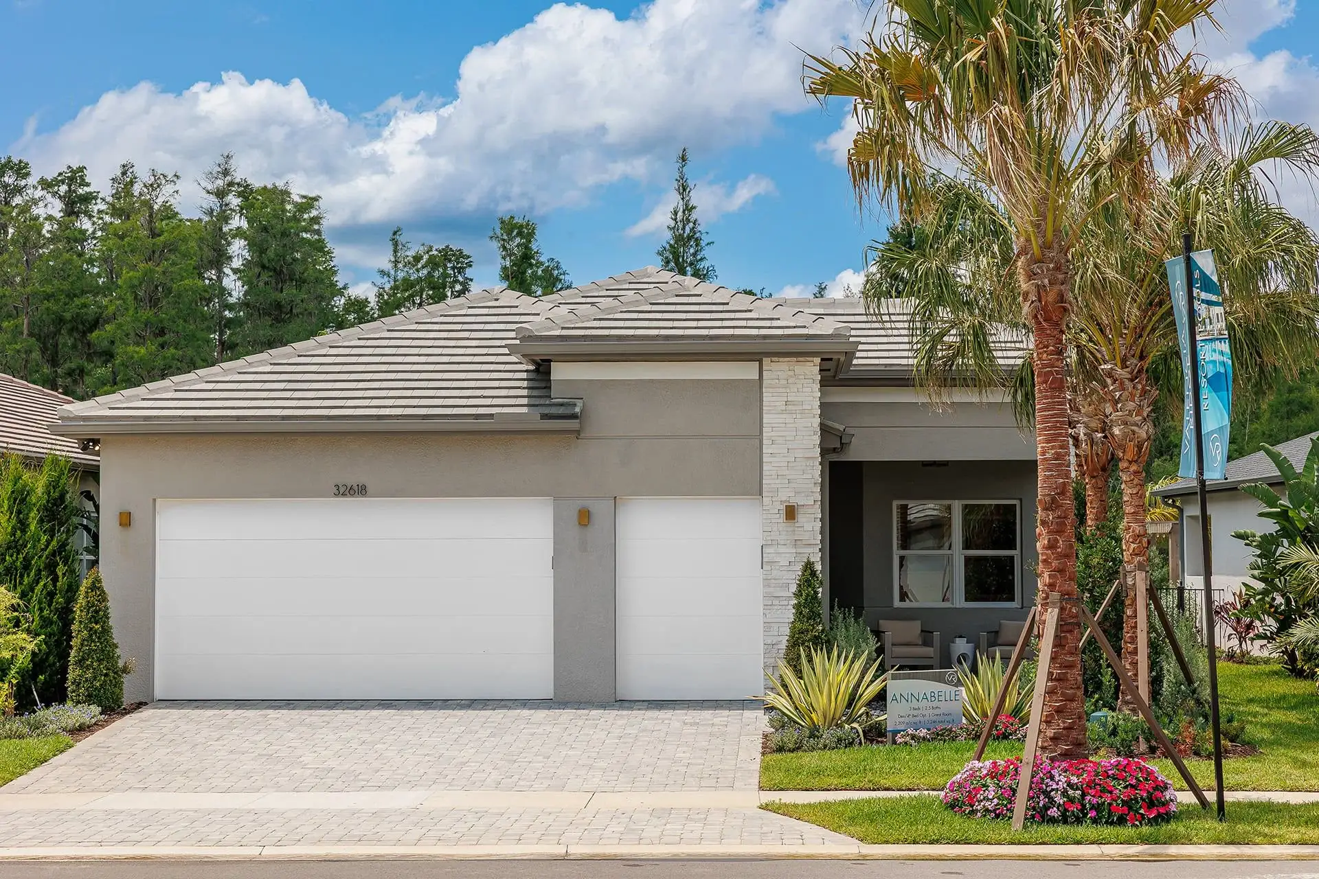 Front exterior of a new home in Valencia Ridge (55+), Wesley Chapel, FL, highlighting curb appeal (Image 1). Front exterior of a new home in Valencia Ridge (55+), Wesley Chapel, FL, highlighting curb appeal (Image 1).