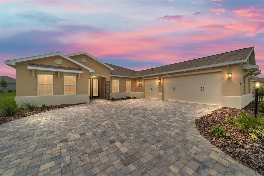 Front exterior of a new home in On Top of the World Communities, Ocala, FL, highlighting curb appeal (Image 1). Front exterior of a new home in On Top of the World Communities, Ocala, FL, highlighting curb appeal (Image 1).