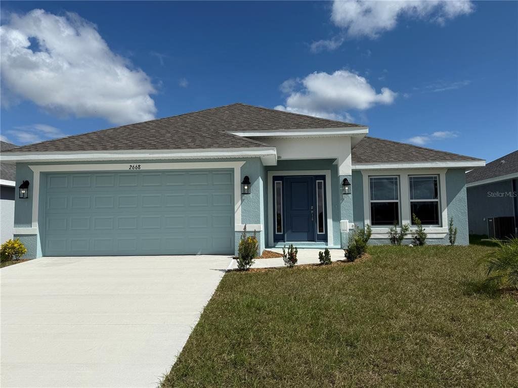 Front exterior of a new home in Watercress Cove, North Port, FL, highlighting curb appeal (Image 1). Front exterior of a new home in Watercress Cove, North Port, FL, highlighting curb appeal (Image 1).