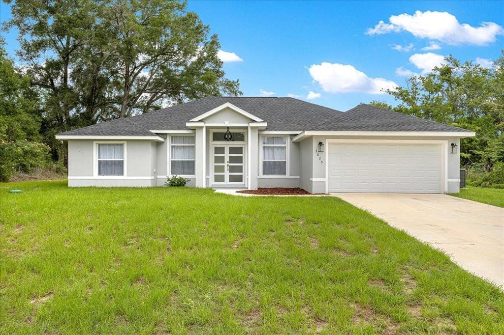 Front exterior of a new home in , Summerfield, FL, highlighting curb appeal (Image 1). Front exterior of a new home in , Summerfield, FL, highlighting curb appeal (Image 1).