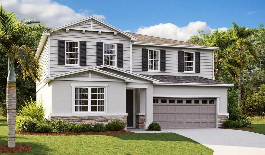 Front exterior of a new home in Seasons at Magnolia Pointe, Umatilla, FL, highlighting curb appeal (Image 1).