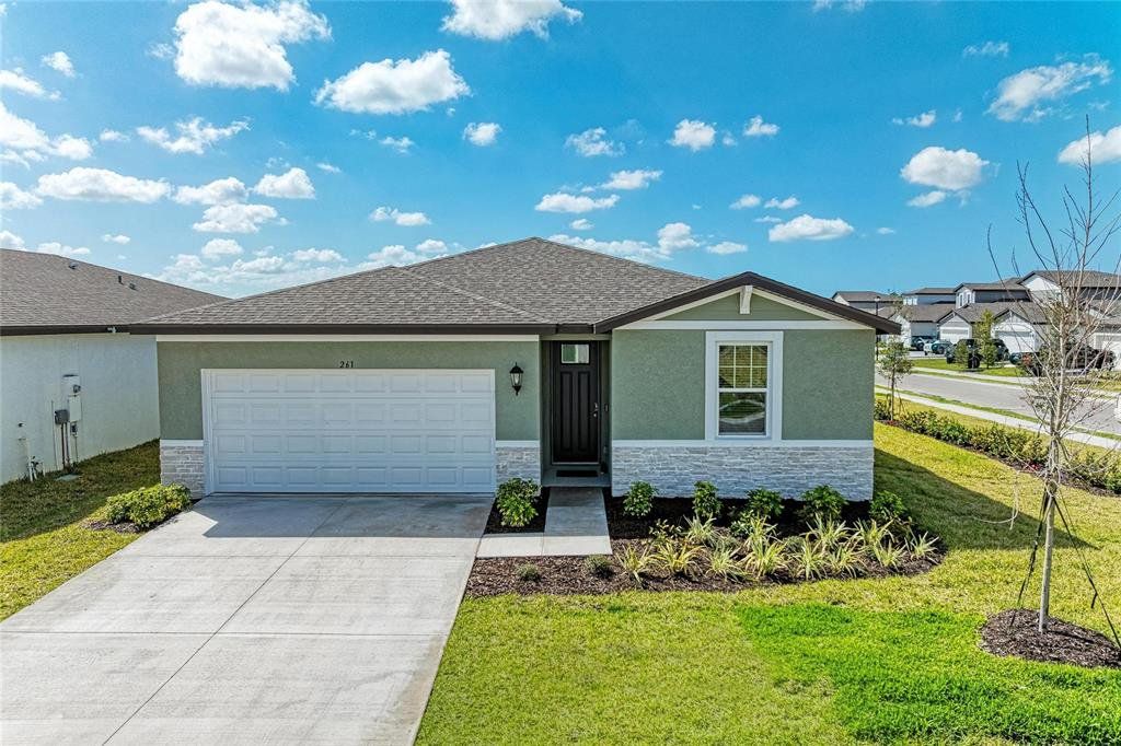 Front exterior of a new home in Magnolia Bay - Classic Series, Nokomis, FL, highlighting curb appeal (Image 1). Front exterior of a new home in Magnolia Bay - Classic Series, Nokomis, FL, highlighting curb appeal (Image 1).