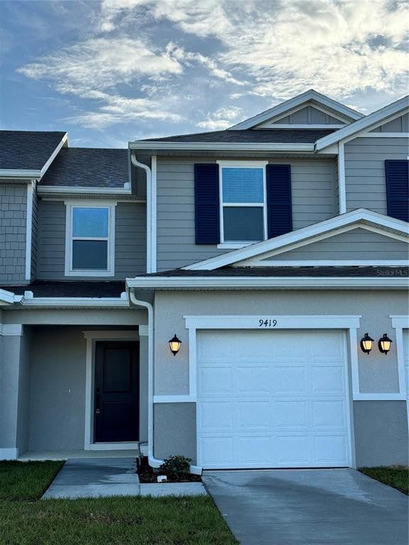 Front exterior of a new home in , Davenport, FL, highlighting curb appeal (Image 1).
