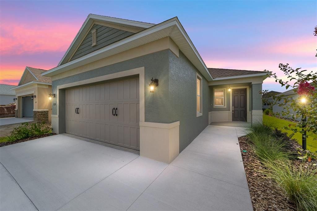 Front exterior of a new home in On Top of the World Communities, Ocala, FL, highlighting curb appeal (Image 1).