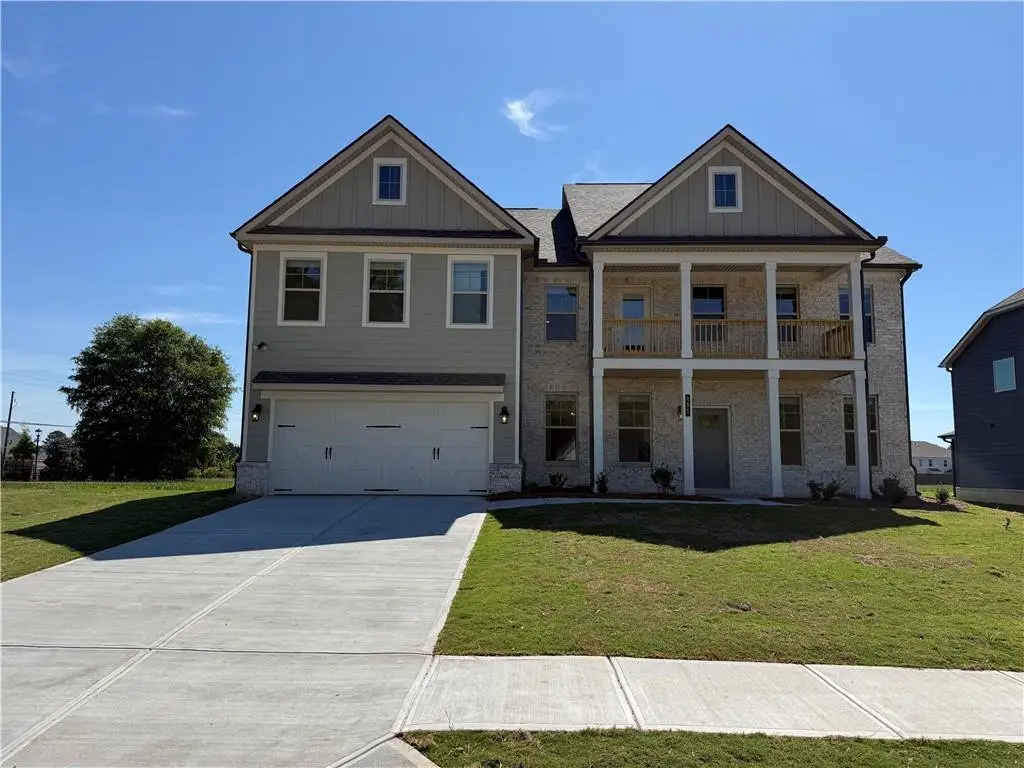 Front exterior of a new home in Grandview at Millers Mill, Stockbridge, GA, highlighting curb appeal (Image 1). Front exterior of a new home in Grandview at Millers Mill, Stockbridge, GA, highlighting curb appeal (Image 1).