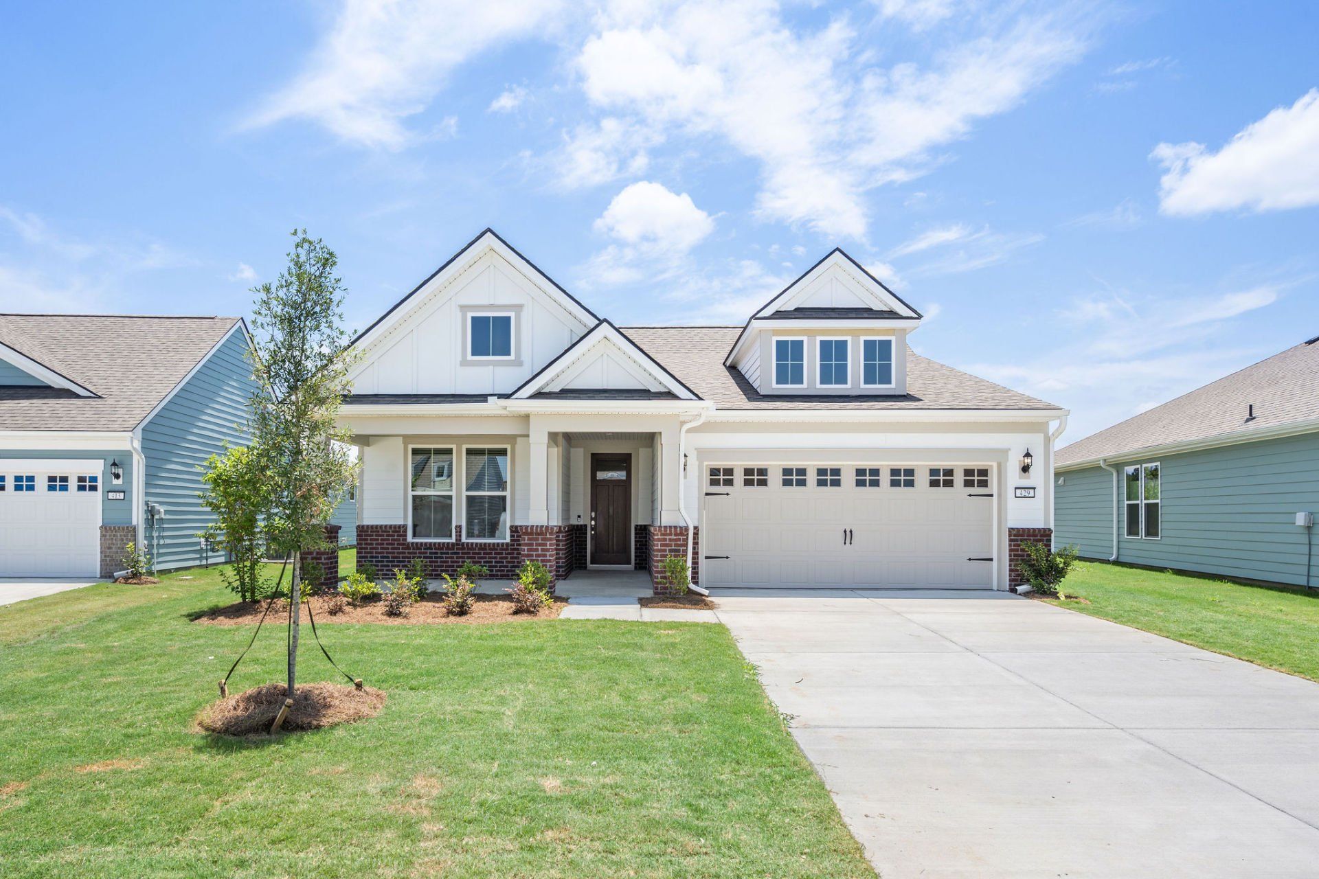 Front exterior of a new home in Del Webb Savannah at Heartwood, Richmond Hill, GA, highlighting curb appeal (Image 1). Front exterior of a new home in Del Webb Savannah at Heartwood, Richmond Hill, GA, highlighting curb appeal (Image 1).