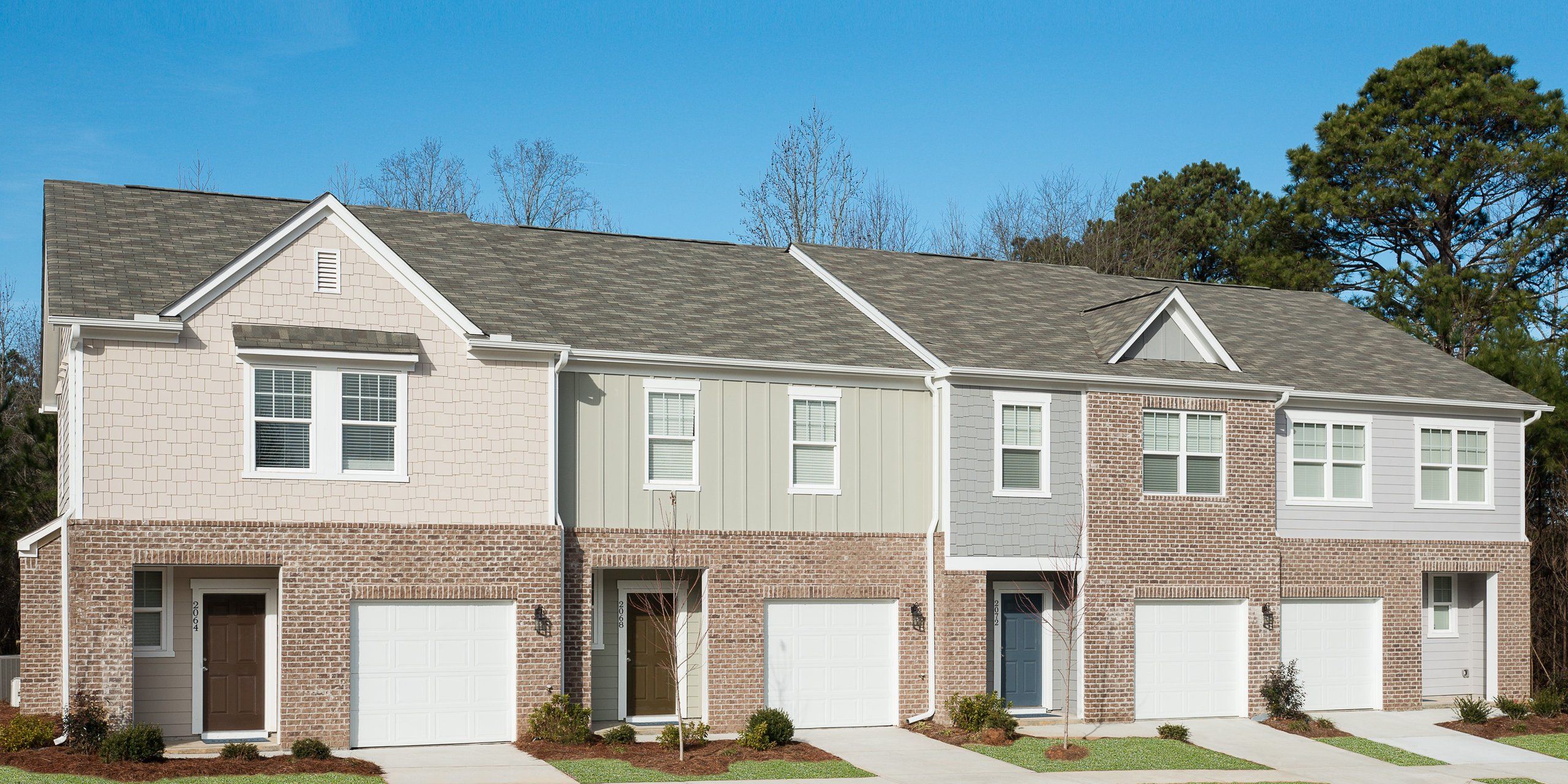 Front exterior of a new home in Greyson Parc, Heron Bay, GA, highlighting curb appeal (Image 1). Front exterior of a new home in Greyson Parc, Heron Bay, GA, highlighting curb appeal (Image 1).