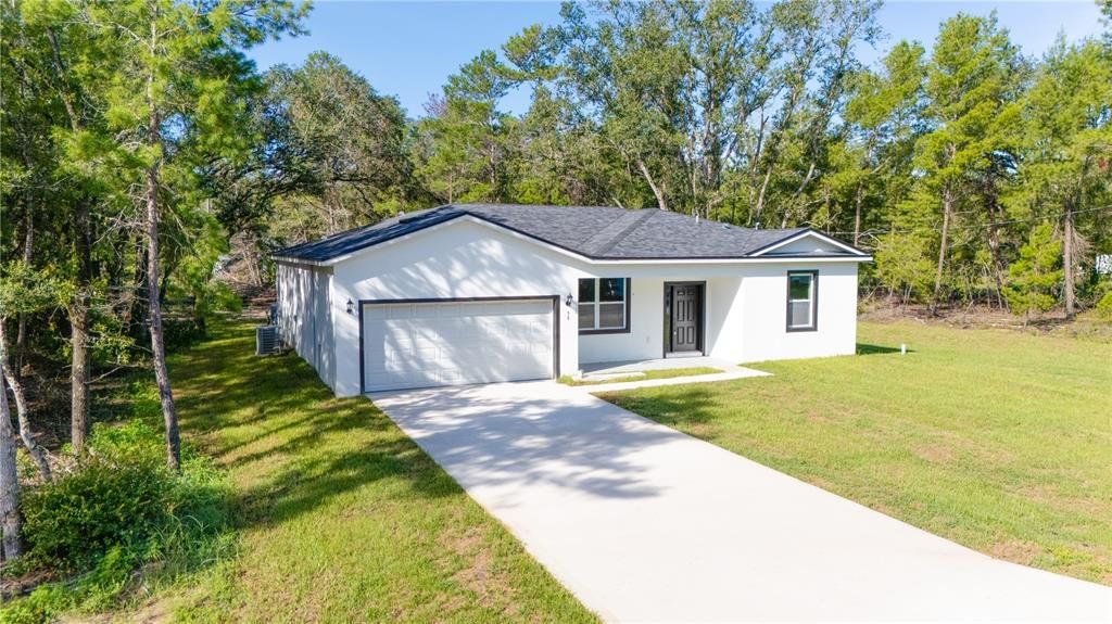 Front exterior of a new home in , Ocklawaha, FL, highlighting curb appeal (Image 1). Front exterior of a new home in , Ocklawaha, FL, highlighting curb appeal (Image 1).