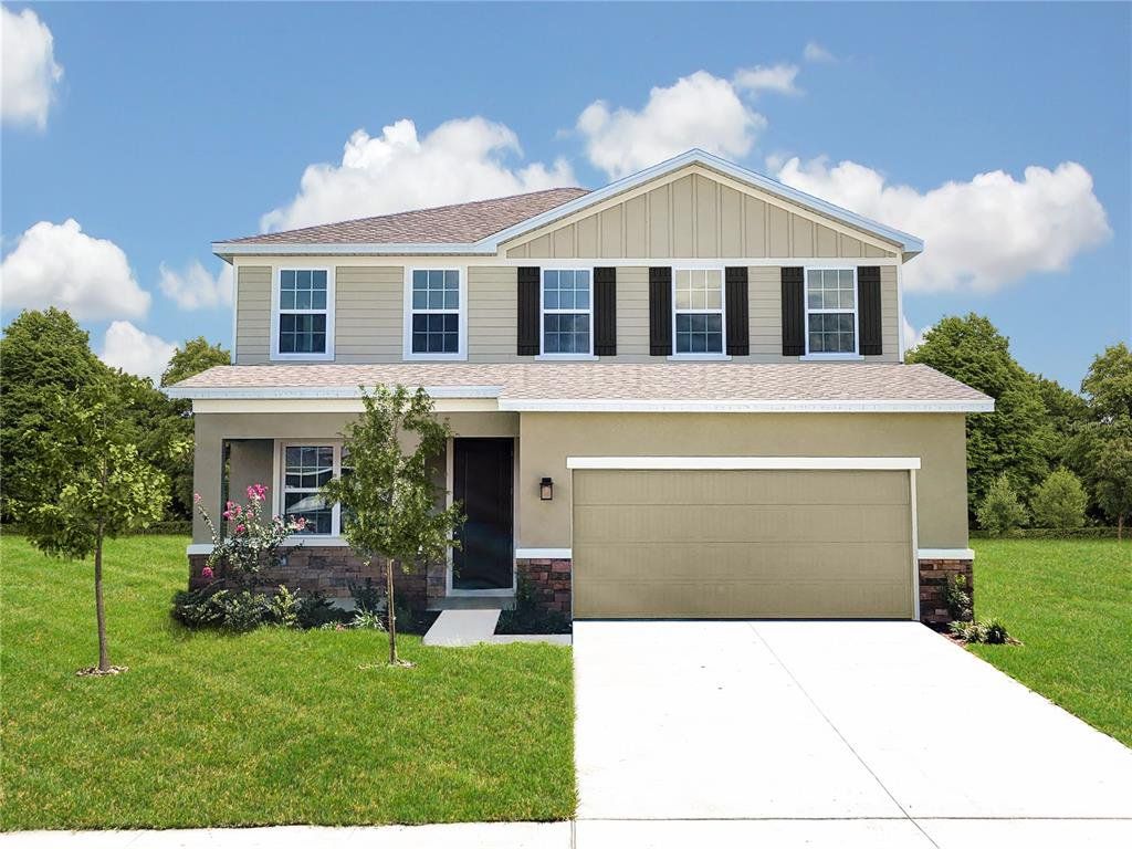 Front exterior of a new home in The Crossings, St. Cloud, FL, highlighting curb appeal (Image 1). Front exterior of a new home in The Crossings, St. Cloud, FL, highlighting curb appeal (Image 1).