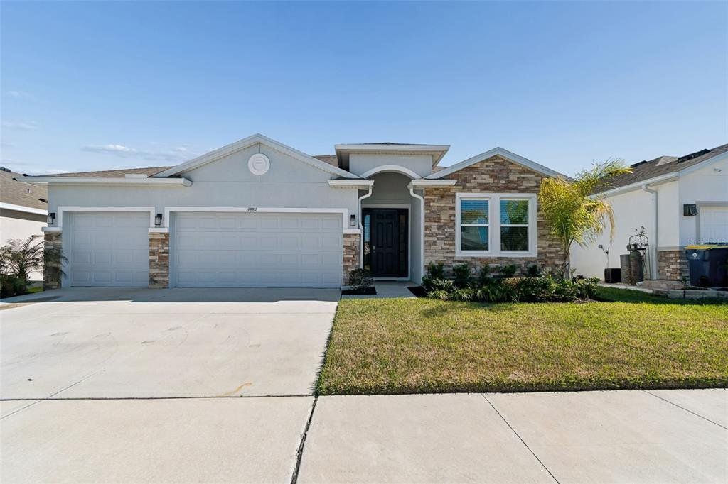 Front exterior of a new home in , Wesley Chapel, FL, highlighting curb appeal (Image 1). Front exterior of a new home in , Wesley Chapel, FL, highlighting curb appeal (Image 1).