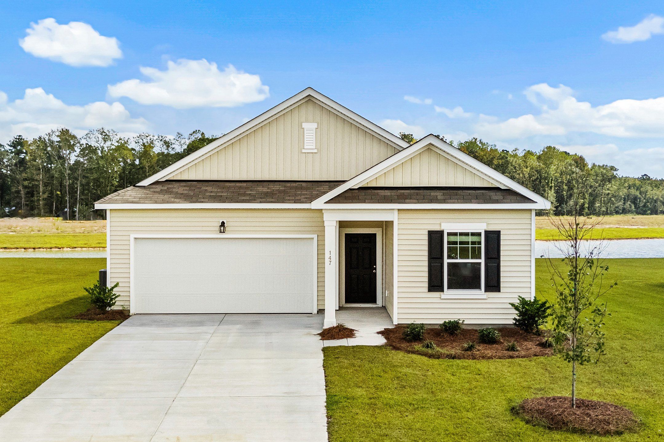 Front exterior of a new home in Bayview, Conway, SC, highlighting curb appeal (Image 1).