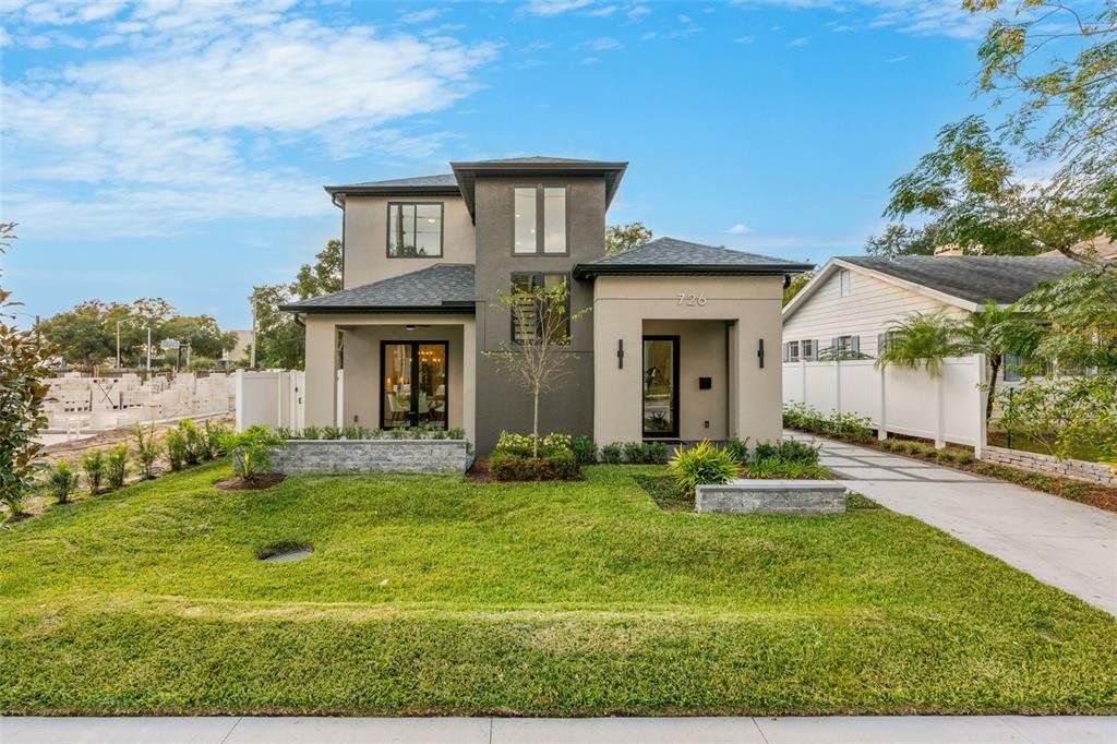 Front exterior of a new home in , Orlando, FL, highlighting curb appeal (Image 1). Front exterior of a new home in , Orlando, FL, highlighting curb appeal (Image 1).