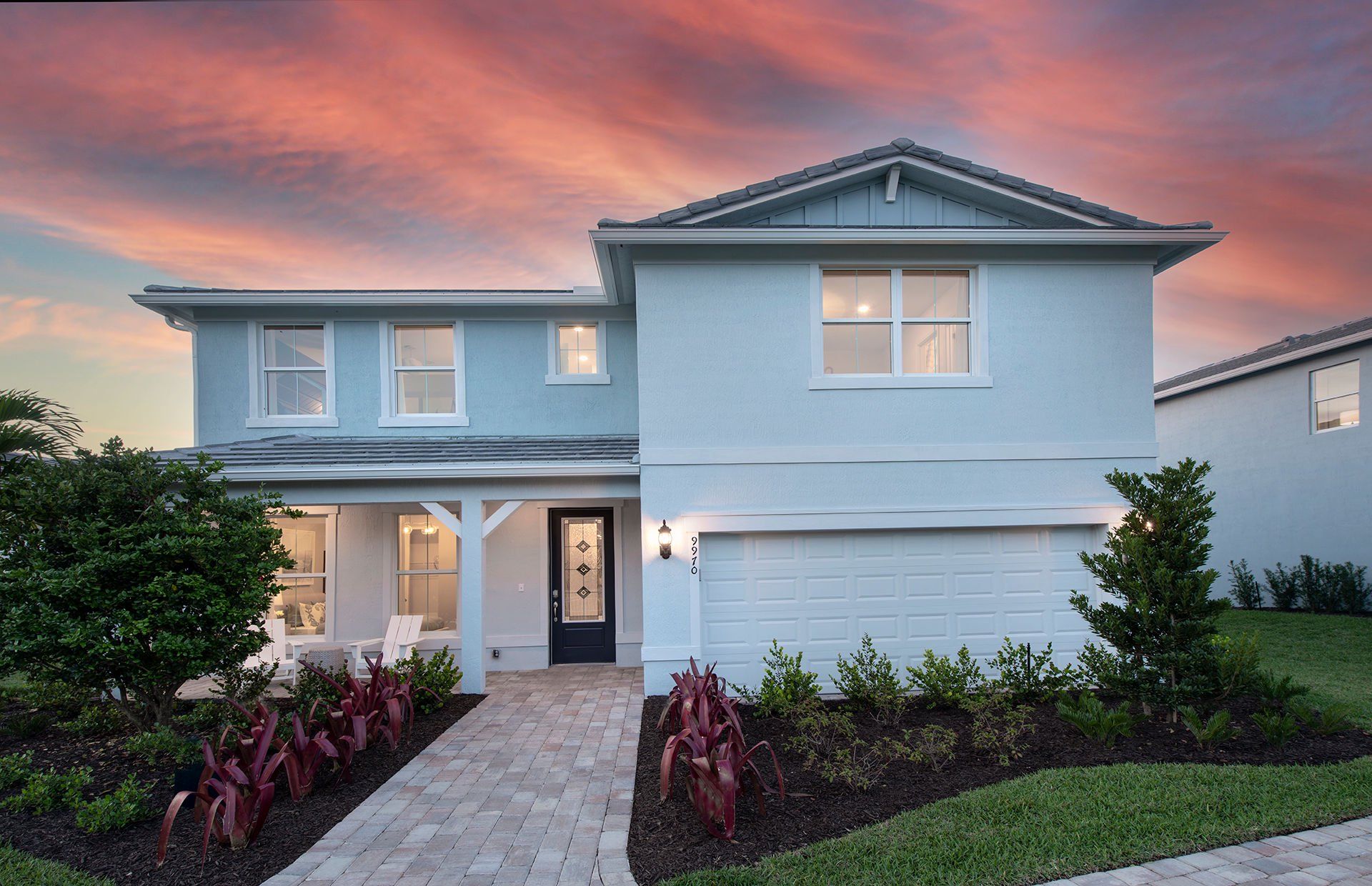 Front exterior of a new home in Highpointe, Stuart, FL, highlighting curb appeal (Image 1). Front exterior of a new home in Highpointe, Stuart, FL, highlighting curb appeal (Image 1).